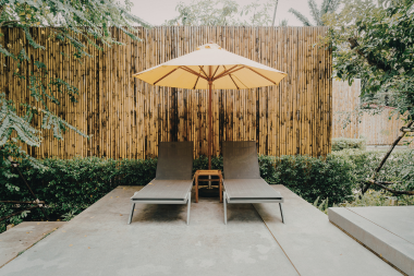 Greater Lansing patio area with brushed concrete and lounge chairs