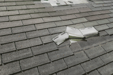 roof line with missing shingles in Greater Lansing