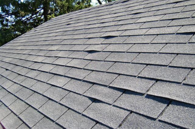 curled asphalt roof shingles in Greater Lansing