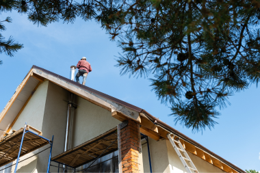 Greater Lansing roofing specialist inspecting roofline