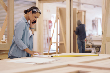 Greater Lansing home remodeler on phone with homeowner