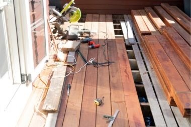 Greater Lansing deck project mid construction with tools
