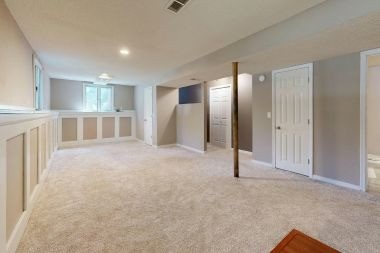 finished basement project in Greater Lansing with egress window and new carpet flooring