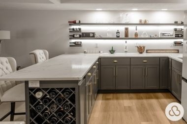 finished basement project in Greater Lansing Michigan built by Custom Built Design and Remodeling with bar and open shelving