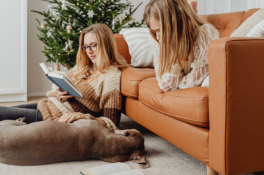 holiday safety upgrades for your home remodel family and dog relaxing in christmas living room custom built michigan