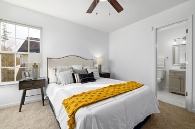 how to design a primary suite addition that feels like a retreat bedroom with ensuite bathroom custom built michigan