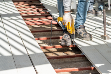 reasons to plan your spring deck build this winter decking contractor nailing composite boards custom built michigan