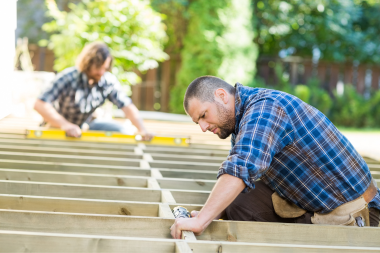 mistakes to avoid when hiring a composite deck contractor builders installing decking joists custom built michigan