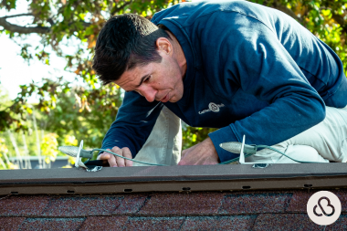 ways you can increase the lifespan of your michigan roof roofing specialist inspecting roofline custom built mi