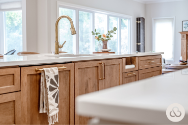 how to plan your kitchen renovation costs around your long term home goals sink in island with gold finished cabinets custom built michigan