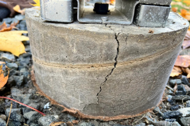 signs that your deck footings arent installed correctly cracked concrete footing above ground custom built michigan