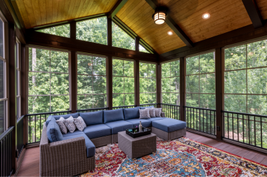 questions to ask before hiring a screened in porch builder covered deck with outdoor sectional couch and rug custom built michigan