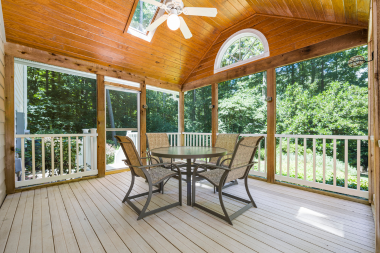 questions to ask before hiring a screened in porch builder covered deck with dining set and ceiling fan custom built michigan