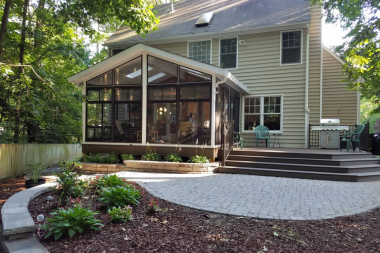 questions to ask before hiring a screened in porch builder backyard outdoor living space with deck and covered structure custom built michigan