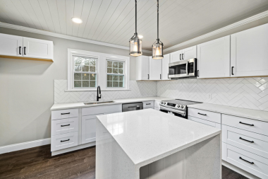 common kitchen layout mistakes homeowners regret later culinary area with narrow walkways and herringbone backsplash custom built michigan