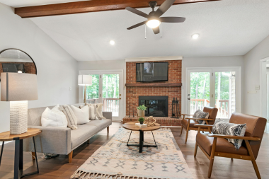 interior design ideas to revitalize your home this spring living room with open flow and brick fireplace custom built michigan