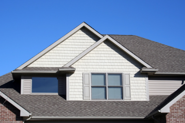 questions to ask your michigan roofing contractor before hiring them front roof face with large windows custom built mi