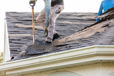 red flags of an unreliable roofing contractor roof remodeler removing damaged asphalt shingles custom built michigan