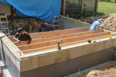top home addition foundation options builders installing crawl space beams custom built michigan