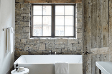 top timeless bathroom remodeling trends natural stone wall with bathtub custom built michigan