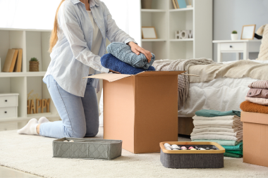 what to expect during a kitchen renovation homeowner putting clothes in storage custom built michigan