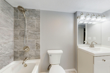 bathroom layout mistakes to avoid for your home remodel tile shower wall and track lighting sink vanity custom built michigan