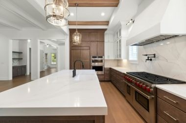 luxury kitchen remodeling project with quartz countertops and slab backsplash