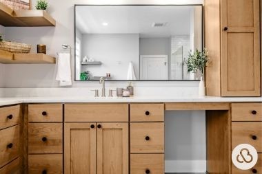luxury bathroom remodeling project in Okemos Michigan with wood cabinetry and silver nickel finished sink faucet
