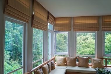 screened in porch with window couch seating