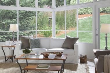screened in porch with vaulted ceiling and sofa in Greater Lansing