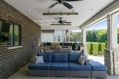 patio enclosure area with outdoor furniture and built in ceiling fans
