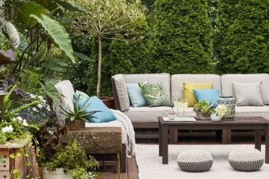 composite deck outdoor living space with landscaping privacy in Greater Lansing