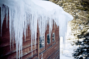 icicles hanging down Greater Lansing Michigan home roof