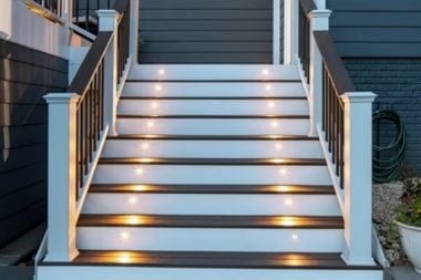 trex composite deck stair lighting with handrails in Greater Lansing