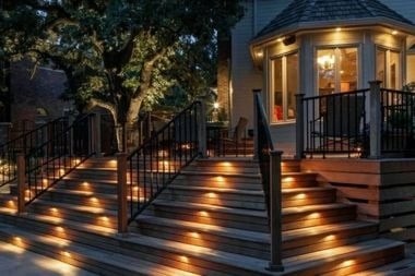 composite deck project with riser lights and recessed lights in Greater Lansing Michigan