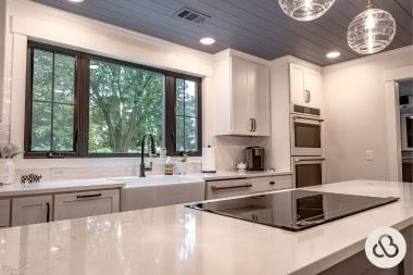 luxury kitchen remodeling project in Greater Lansing Michigan built by Custom Built Design and Remodeling with induction cooktop and quartz island