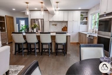 luxury kitchen remodeling project in Greater Lansing built by Custom Built Design and Remodeling with large island and dura supreme cabinetry