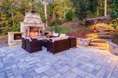 Greater Lansing outdoor living space with bluestone pavers and fireplace
