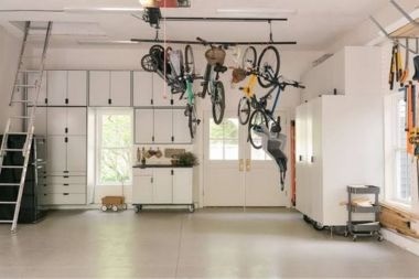 garage addition with ceiling bike rack and built in cabinetry Greater Lansing Michigan