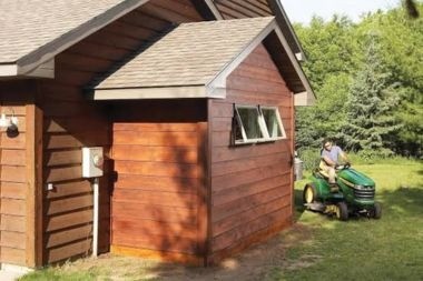 garage bump out addition with brown siding in Greater Lansing