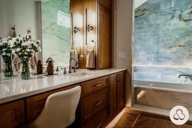 luxury bathroom remodeling project with undermount cabinetry and whirlpool bathtub built by Custom Built Design and Remodeling in Greater Lansing