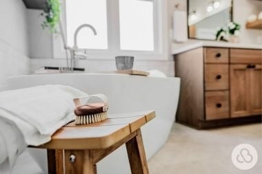 luxury bathroom remodeling project in Greater Lansing built by Custom Built Design and Remodeling with freestanding tub and dura supreme vanity
