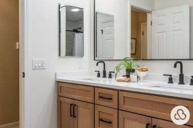 luxury bathroom remodeling project with double sink vanity built by Custom Built Design and Remodeling in Greater Lansing