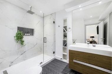 bathroom remodeling project with solid shower wall in Greater Lansing