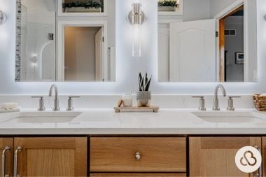 luxury bathroom remodeling project built by Custom Built Design and Remodeling in Greater Lansing with double sink vanity and high quality cabinetry