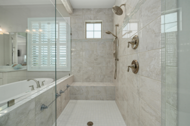 Greater Lansing luxury bathroom remodeling project with wet room and built in bathtub