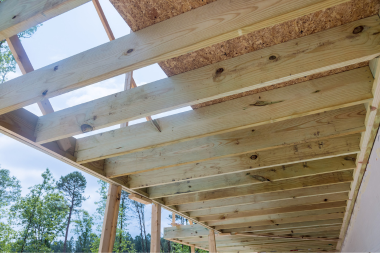 underside of Greater Lansing deck with wood joists