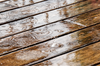 Greater Lansing deck with rain dripping on top