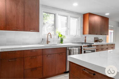 Greater Lansing kitchen remodeling project built by Custom Built Design and Remodeling with brown cabinets and quartz countertops
