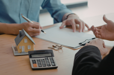 Greater Lansing homeowner discussing insurance policy with agent